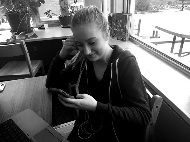 Mackenzie Listening to Music in the library 