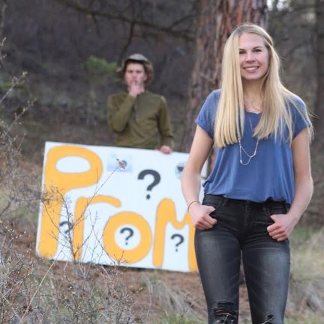 Junior Gabe Jourdonnais sneaks up on junior, Jade Sautter asking her to prom during a photoshoot.