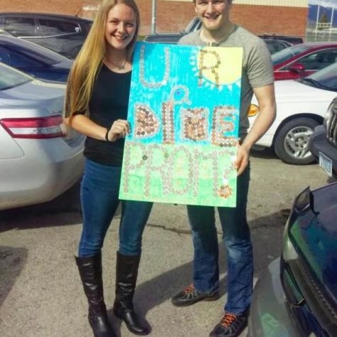 Senior Jake Riekena asks senior Jordan Shoupe to prom with a creative poster made out of dimes.