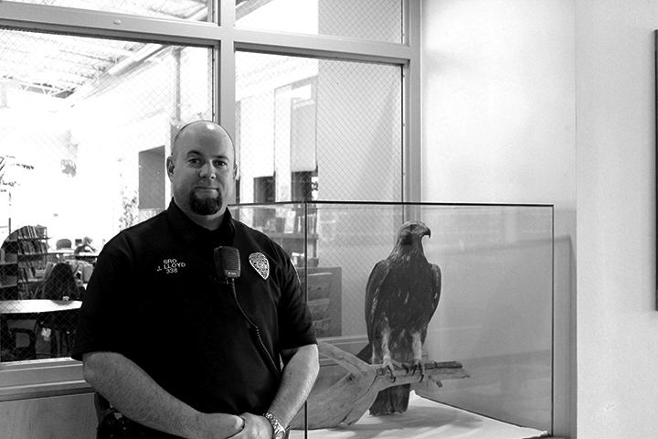 officer Loyd standing in front of the library