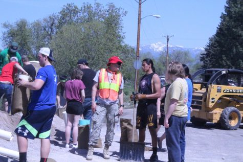 Students talk with a volunteer about what to do next.