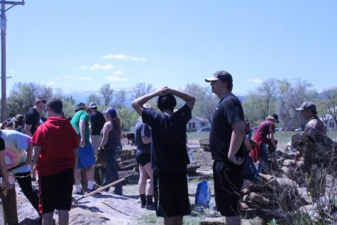 Students stand around, discussing what to do next.