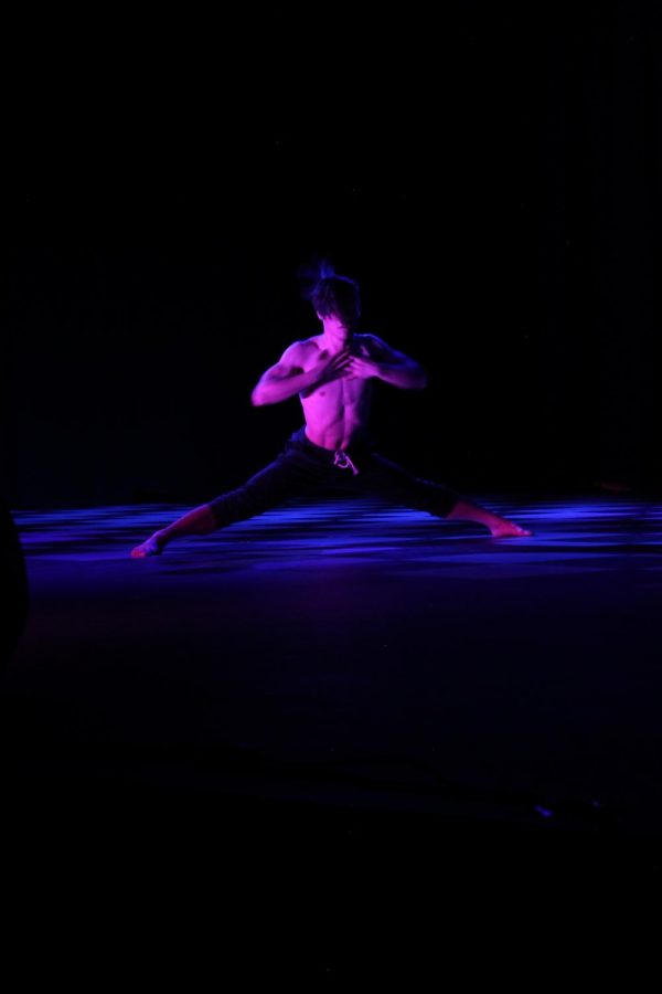 Young man dancing stage.