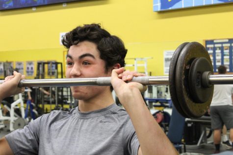 Student lifts weight