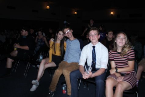 Students sit in chairs