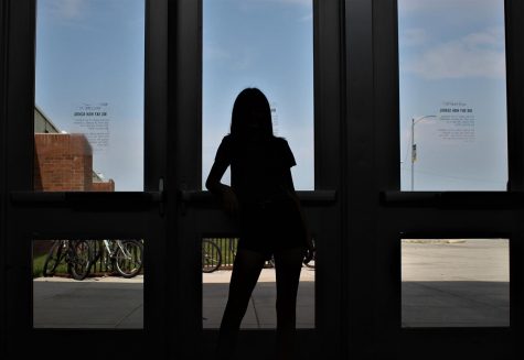 silhouette of a student against the door