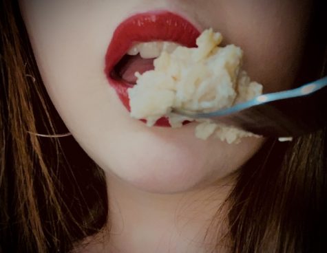 girl eating rice pudding close up