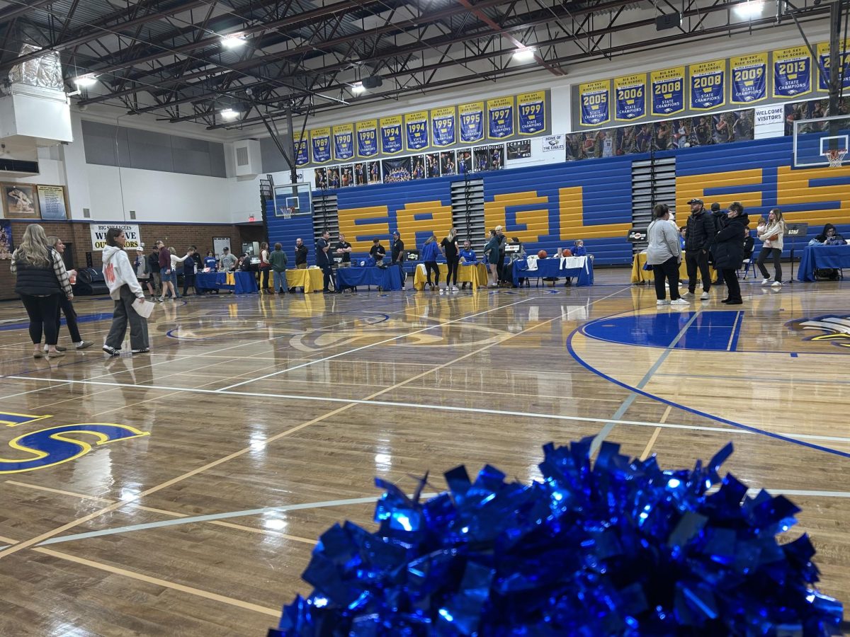 Prospective parents and students visit tables in the main gym during the 2025 freshmen open house at Big Sky High School. 