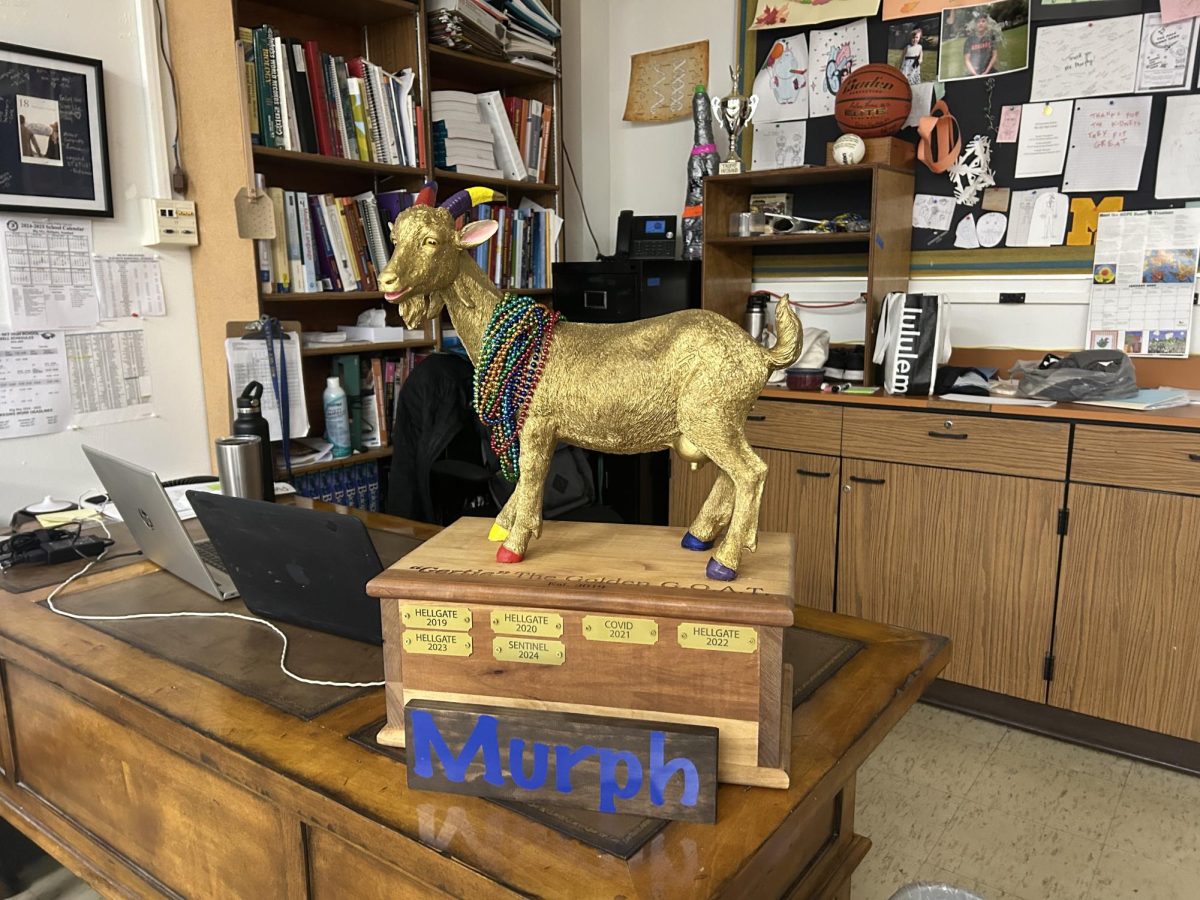 Gertie, the golden goat trophy for the GOAT games school spirit competition, sits on Big Sky boys' varsity coach Zach Murphy's desk, February 2025. 