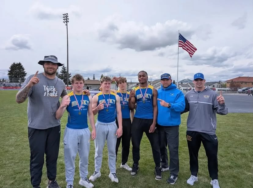 The 2025 boys' track 4x4 team stands for a photo with coaches after winning at divisionals in Butte. Posted on the Big Sky High School Instagram page. According to the post, the team's time of 3:20.7 broke Big Sky's 32-year-old record by 2.3 seconds. 